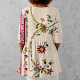 Clara | Blouse longue en lin avec motif floral folklorique et ourlet orné