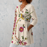 Clara | Blouse longue en lin avec motif floral folklorique et ourlet orné