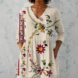 Clara | Blouse longue en lin avec motif floral folklorique et ourlet orné